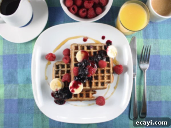 Wholesome Blueberry Waffles, Bursting with Fresh Berry Goodness 2 Whole Wheat Waffles with Blueberry Syrup // FoodNouveau.com