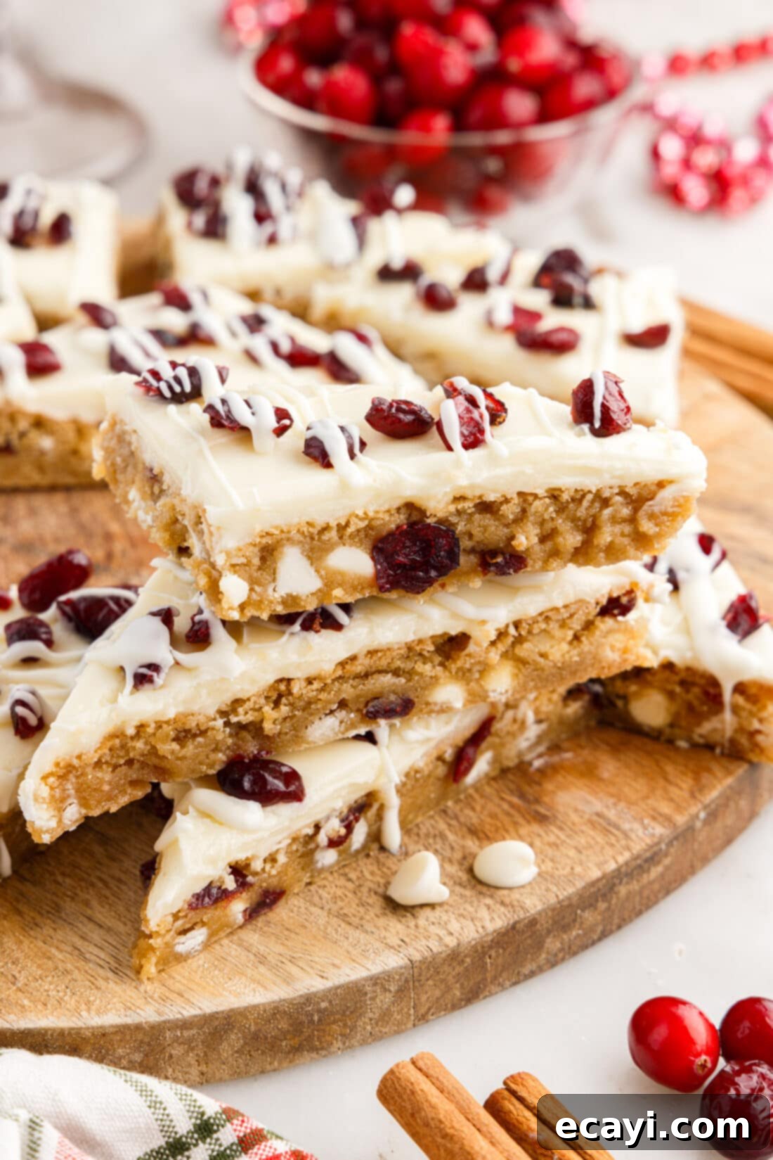 Dreamy Cranberry Squares 2 Stack of Cranberry Bliss Bars glistening with frosting and drizzled white chocolate