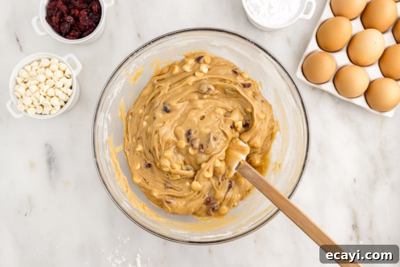 Dreamy Cranberry Squares 9 Blondie dough with white chocolate chips and dried cranberries in a mixing bowl