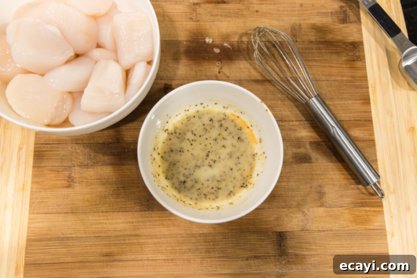 Succulent Grilled Scallops 6 seasoned butter in a bowl next to scallops