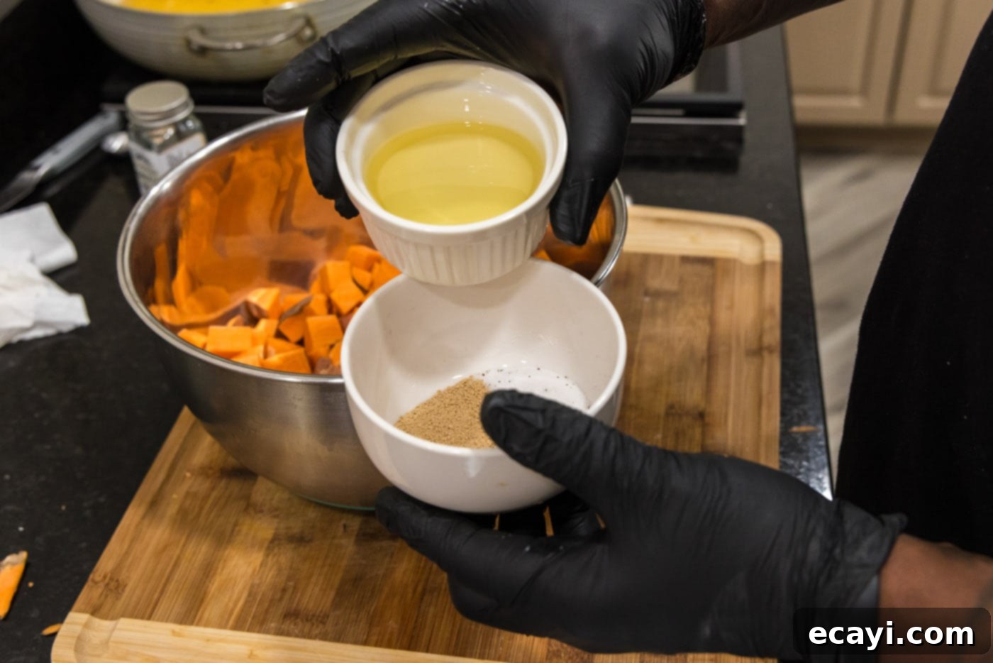 The Ultimate Roasted Sweet Potatoes 6 adding olive oil to seasonings in a bowl