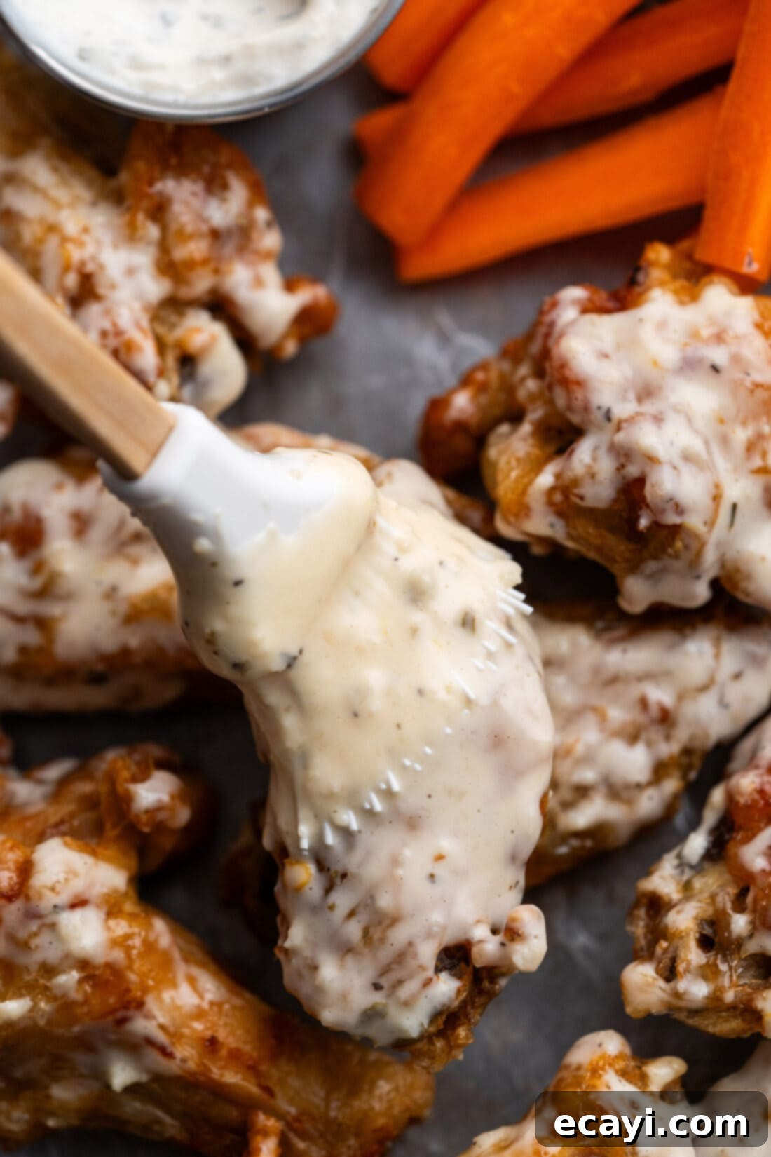 Ultimate Garlic Parmesan Wing Sauce 3 Garlic Parmesan Wing Sauce being brushed on wings