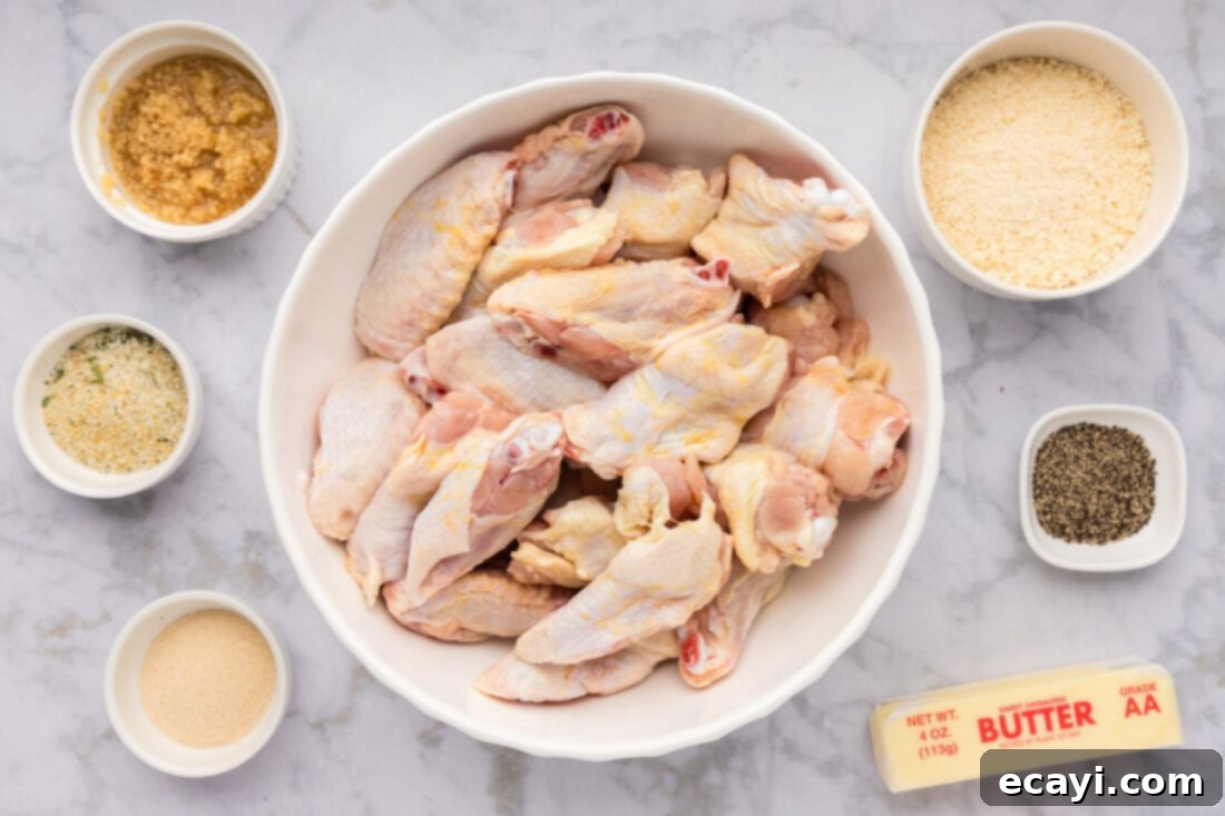 Crispy Garlic Parmesan Wings 4 Arrangement of ingredients for garlic parmesan wings including chicken, butter, garlic, and parmesan