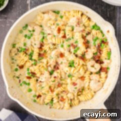 Surf and Turf Carbonara 18 Close up photo of a skillet of Chicken and Shrimp Carbonara