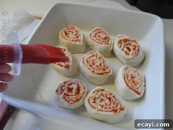 Pizza Pinwheels 9 Pizza dough log wrapped in parchment paper, chilling in the freezer.