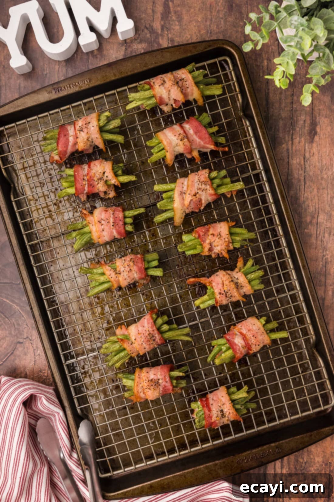 Bacon Green Bean Bundles 2 Crispy Bacon Wrapped Green Beans on a wire rack, ready to serve