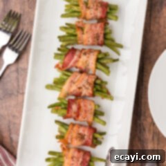 Bacon Green Bean Bundles 12 Bacon Wrapped Green Beans on a white platter