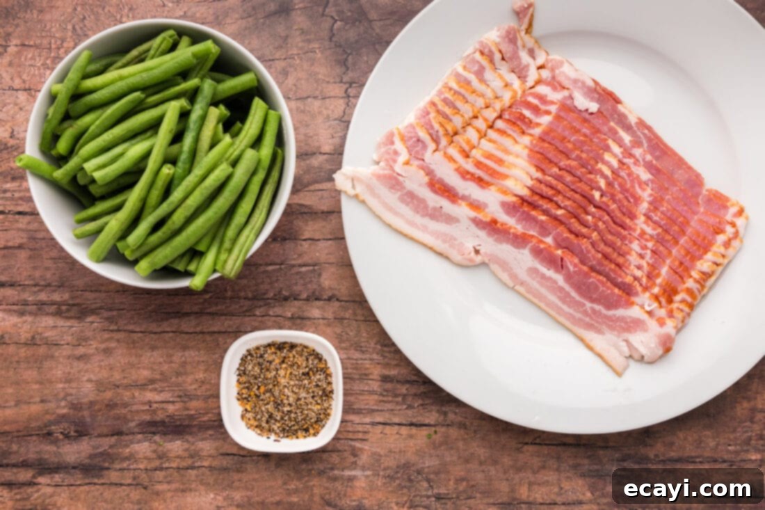 Bacon Green Bean Bundles 4 Ingredients for Easy Bacon Wrapped Green Beans laid out on a cutting board