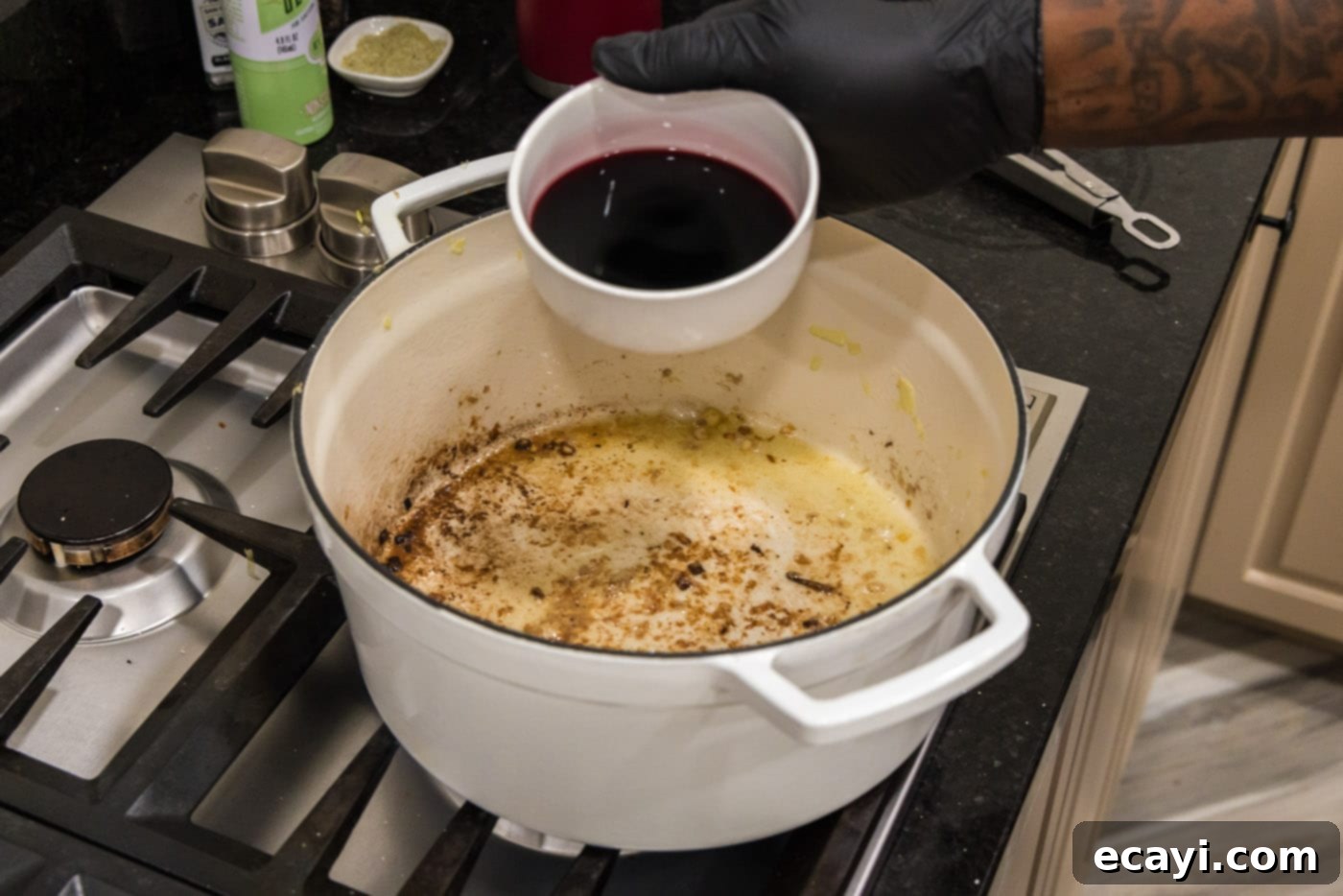 Fork-Tender Beef Short Ribs 11 adding red wine to dutch oven