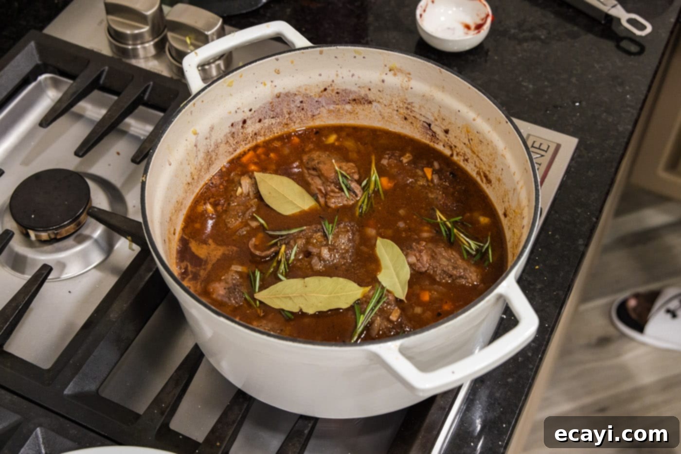 Fork-Tender Beef Short Ribs 15 braised beef short ribs in red wine sauce with rosemary and bay leaves