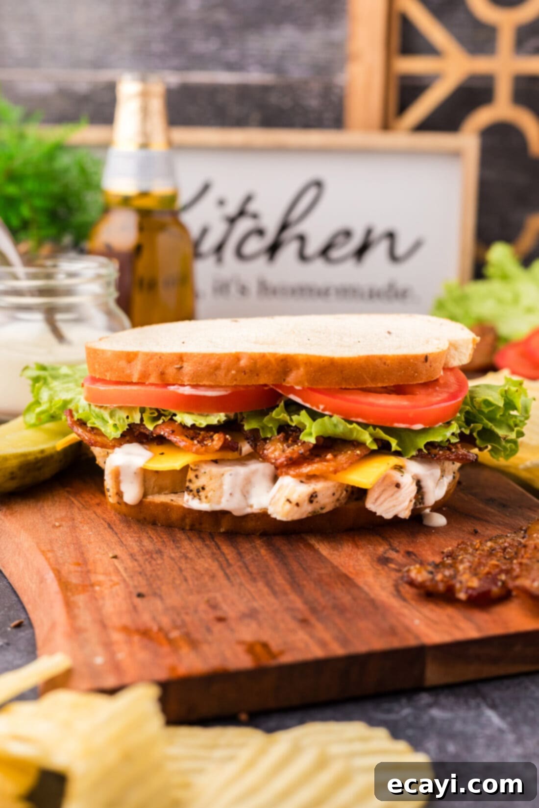 Ultimate Chicken Bacon Ranch Stack 3 Delicious Chicken Bacon Ranch Sandwich arranged on a rustic wooden serving tray