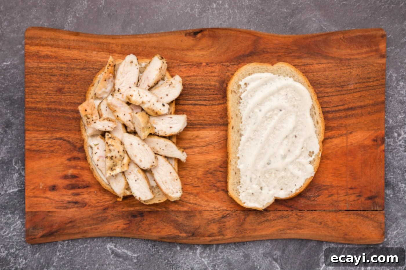 Ultimate Chicken Bacon Ranch Stack 6 sliced chicken breast laid over ranch dressing on rye bread