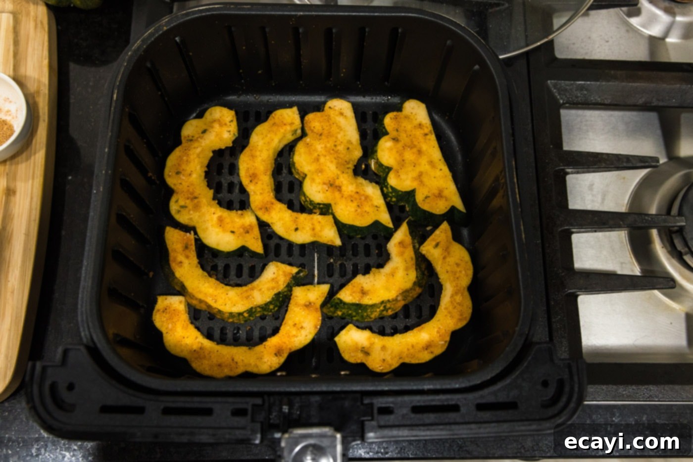 Delicious Air Fryer Acorn Squash 13 acorn squash slices in an air fryer basket
