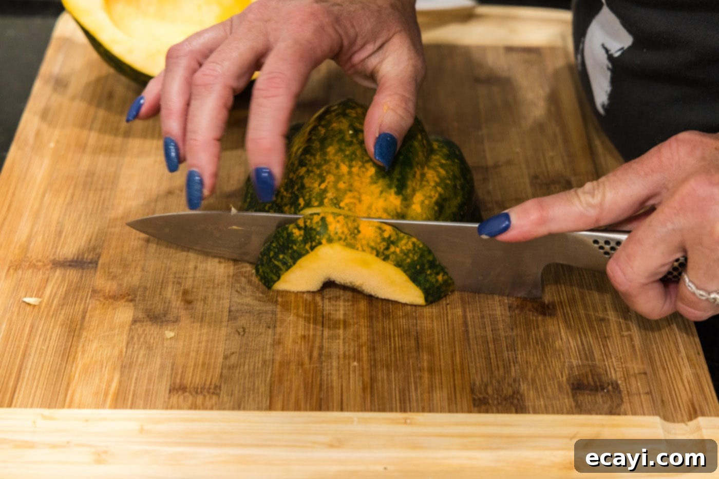 Delicious Air Fryer Acorn Squash 9 slicing acorn squash into half moon shapes