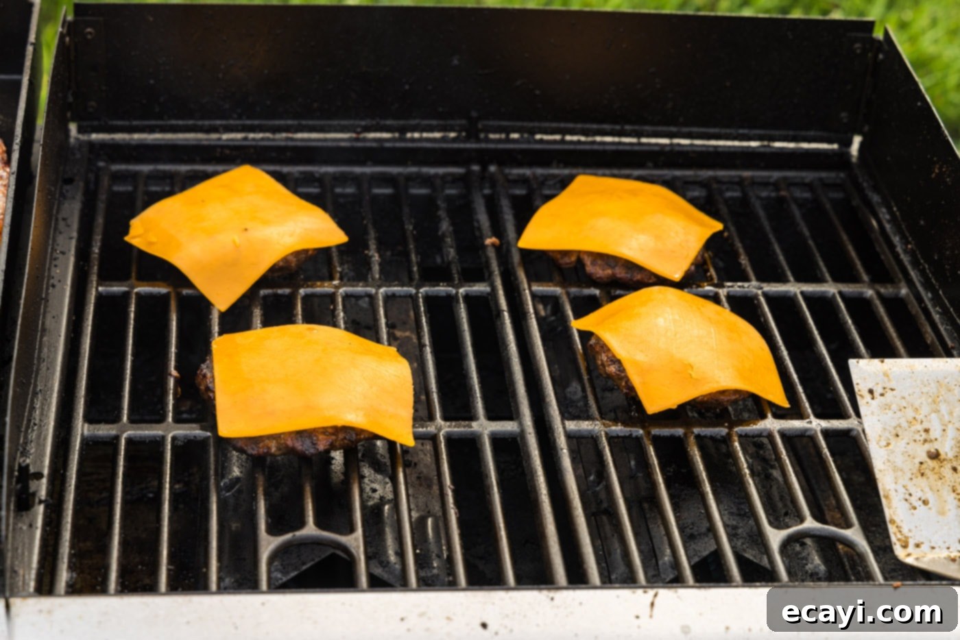 Smoky BBQ Bacon Burgers 11 sliced cheddar cheese on top of burger patties