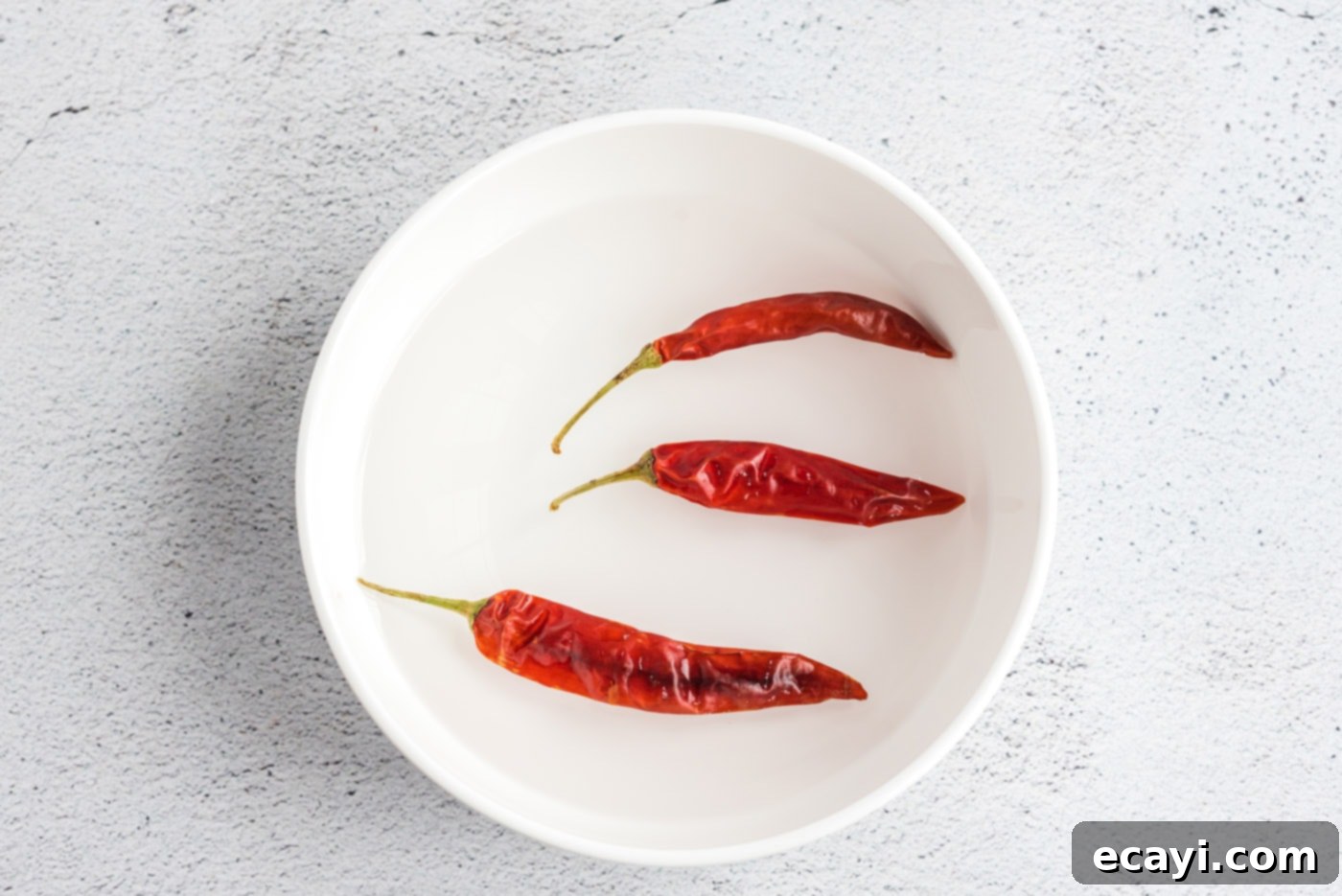 Spicy Szechuan Kung Pao Chicken 7 red chiles in a bowl of water