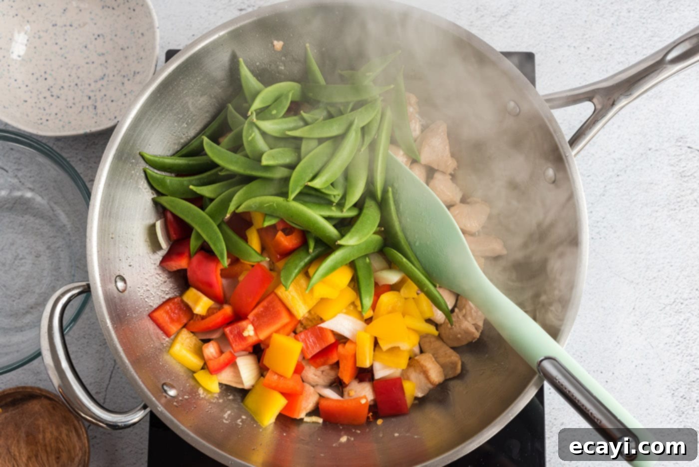 Spicy Szechuan Kung Pao Chicken 10 veggies with chicken in a wok