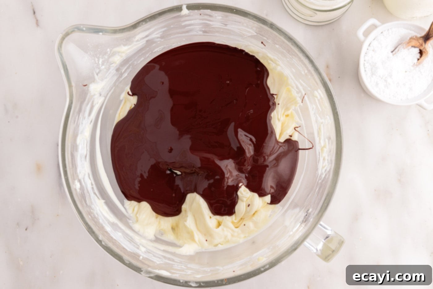 Decadent No-Bake Chocolate Cheesecake 13 melted chocolate added to cheesecake mixture in a bowl
