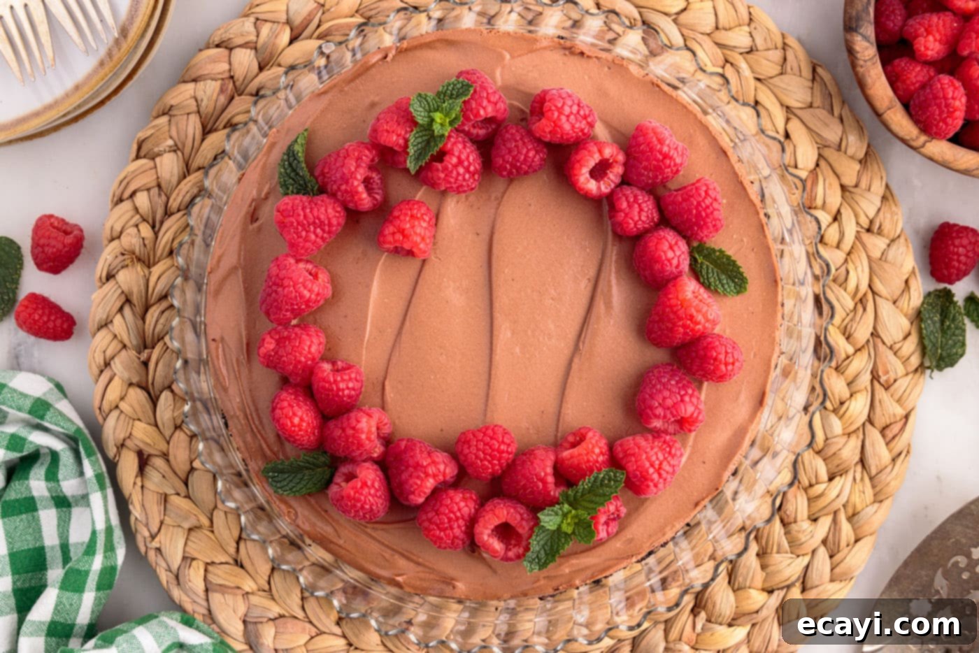 Decadent No-Bake Chocolate Cheesecake 19 fresh raspberries and mint on top of no bake chocolate cheesecake