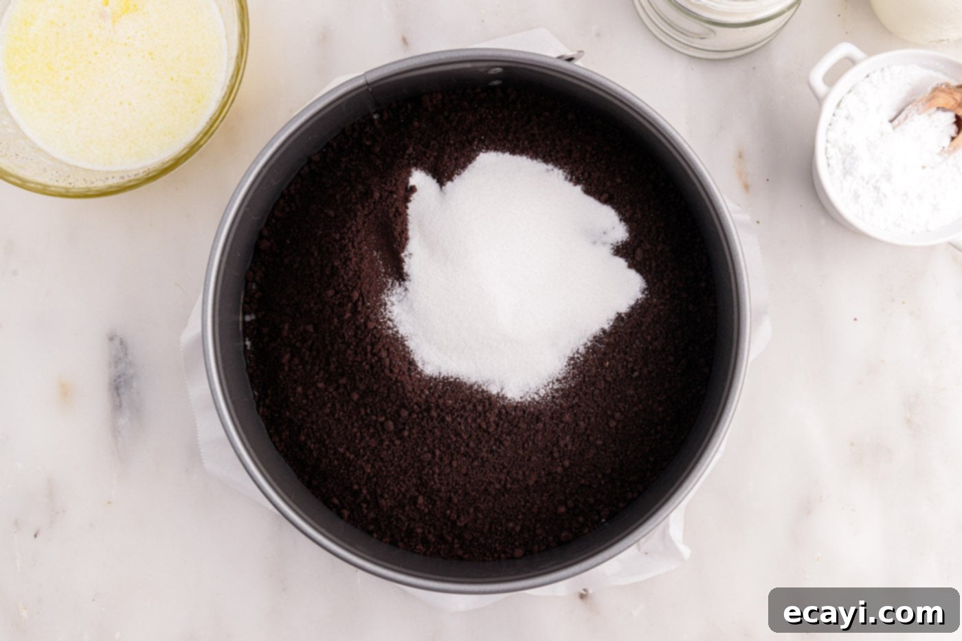 Decadent No-Bake Chocolate Cheesecake 7 chocolate graham cracker crumbs and sugar in a springform pan