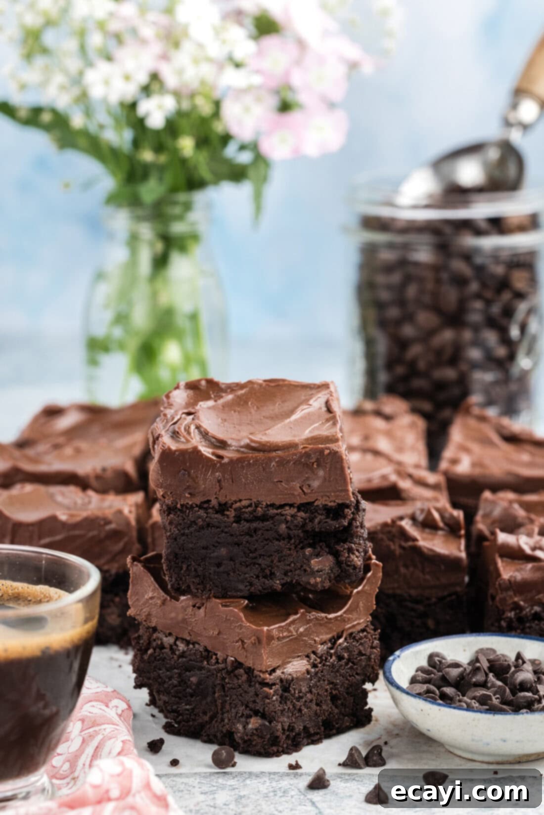 Decadent Espresso Fudge Brownies 11 Stack of Fudge Frosted Espresso Brownies with a rich, dark frosting and visible layers, showing their thick, decadent nature