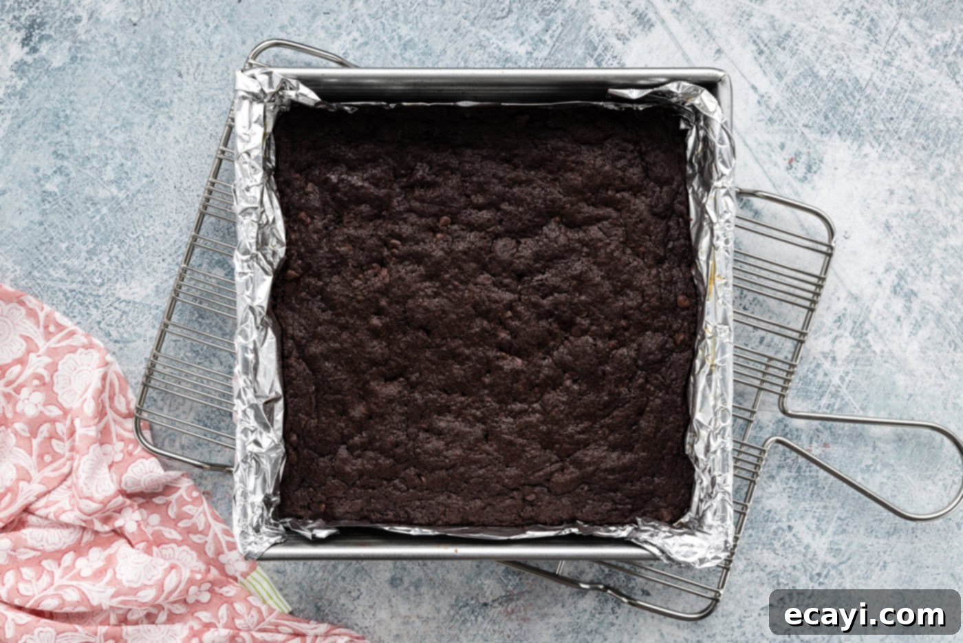 Decadent Espresso Fudge Brownies 7 Overhead shot of freshly baked espresso brownies cooling in the baking pan on a wire rack, ready for frosting