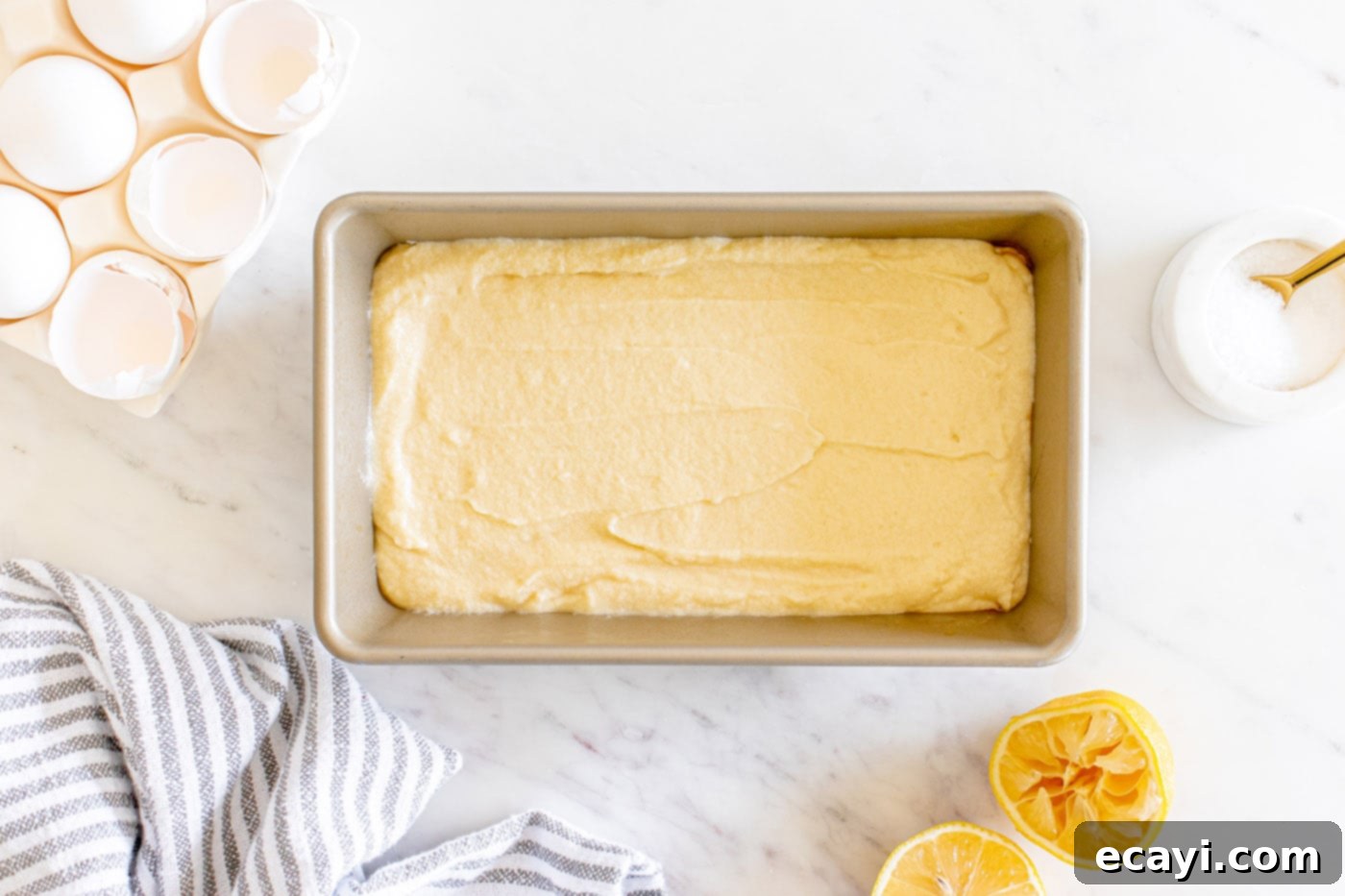 Zesty Lemon Loaf 11 lemon loaf batter in a pan