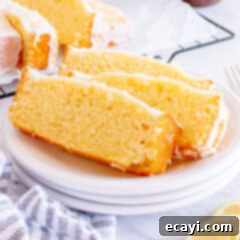 Zesty Lemon Loaf 16 Sliced of Lemon Pound Cake on a plate, showing a perfect, moist crumb.