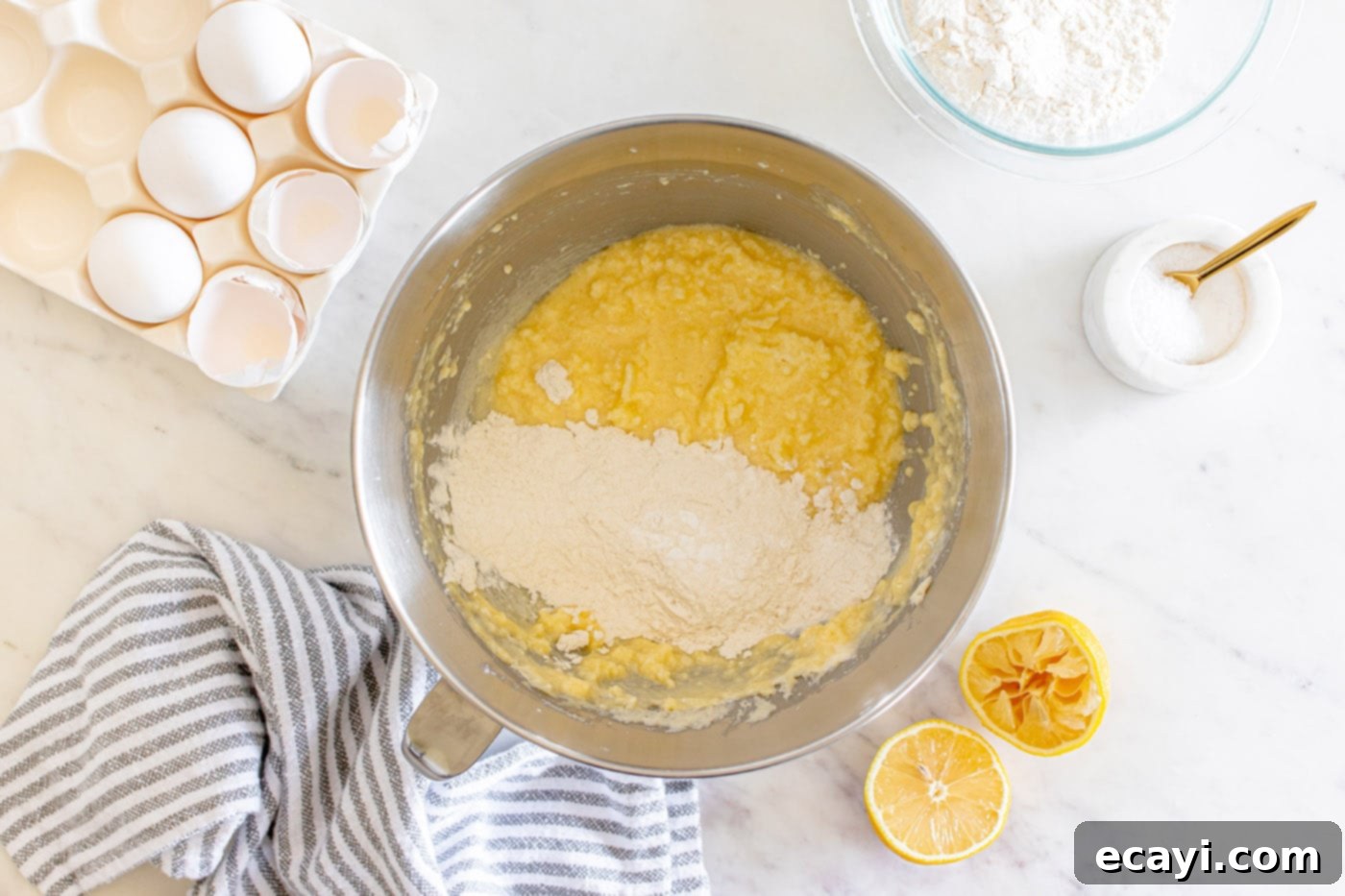 Zesty Lemon Loaf 9 incorporating dry ingredients into wet ingredients for pound cake