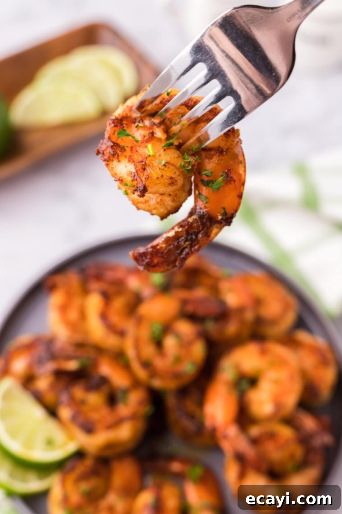 Fiery Prawns 11 Spicy Shrimp on a fork, showing the vibrant seasoning