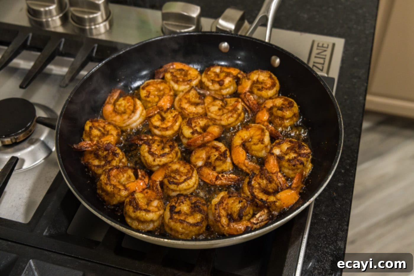 Fiery Prawns 9 cooked seasoned shrimp in a skillet