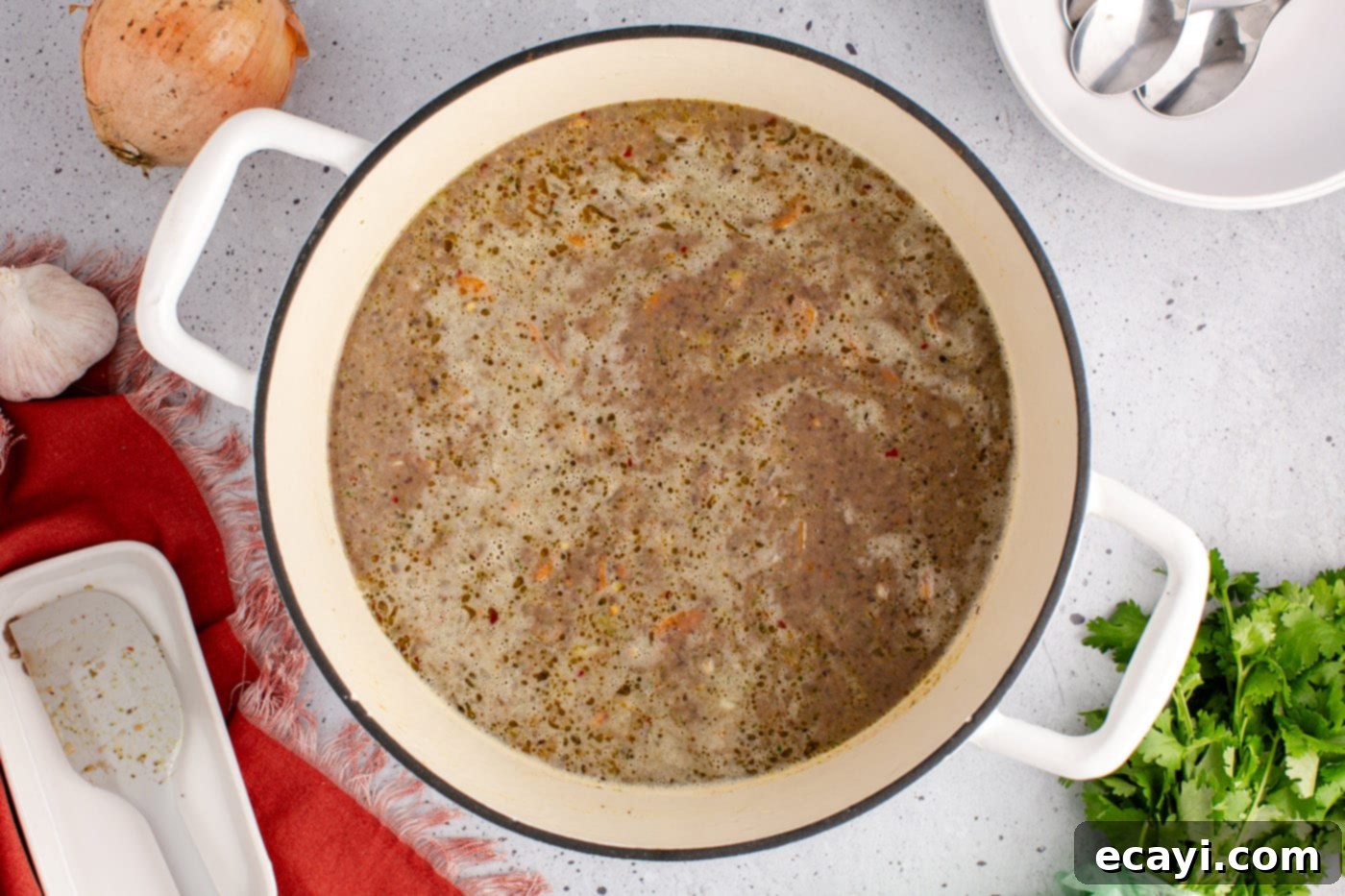 Savory Black Bean Delight 13 A pot of creamy and rich black bean soup, with a smooth, thick consistency, ready to be served and enjoyed.