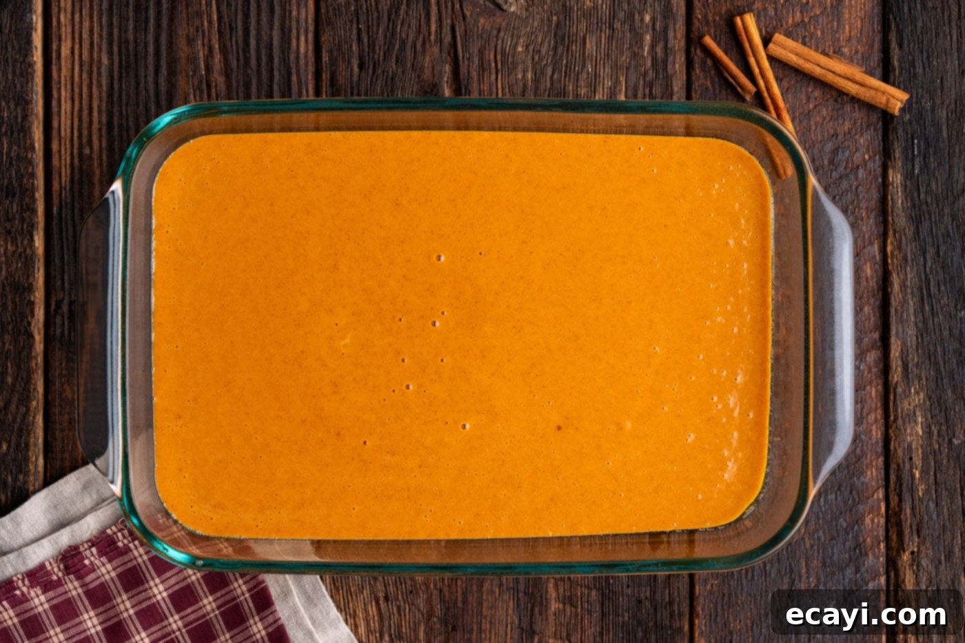 Effortless Pumpkin Spice Bake 7 pumpkin batter in a baking dish
