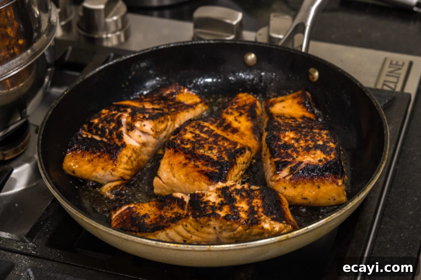 Caramelized Honey Salmon 12 seared salmon filets in a skillet