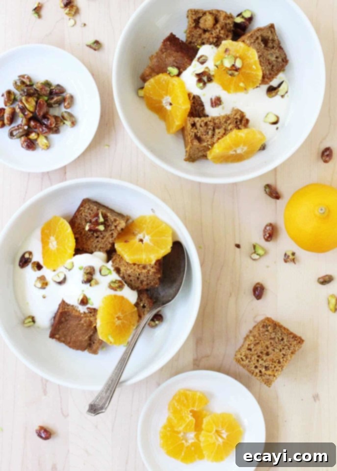 Aromatic Sunshine Carrot Cake with Vanilla Cloud and Pistachio Sparkle 4 A delicious slice of Orange and Cardamom Carrot Cake with Vanilla Yogurt and Candied Pistachios, beautifully presented.