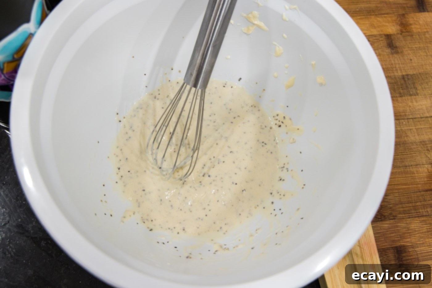 Classic Lobster Salad 6 whisking mayo dressing in a bowl
