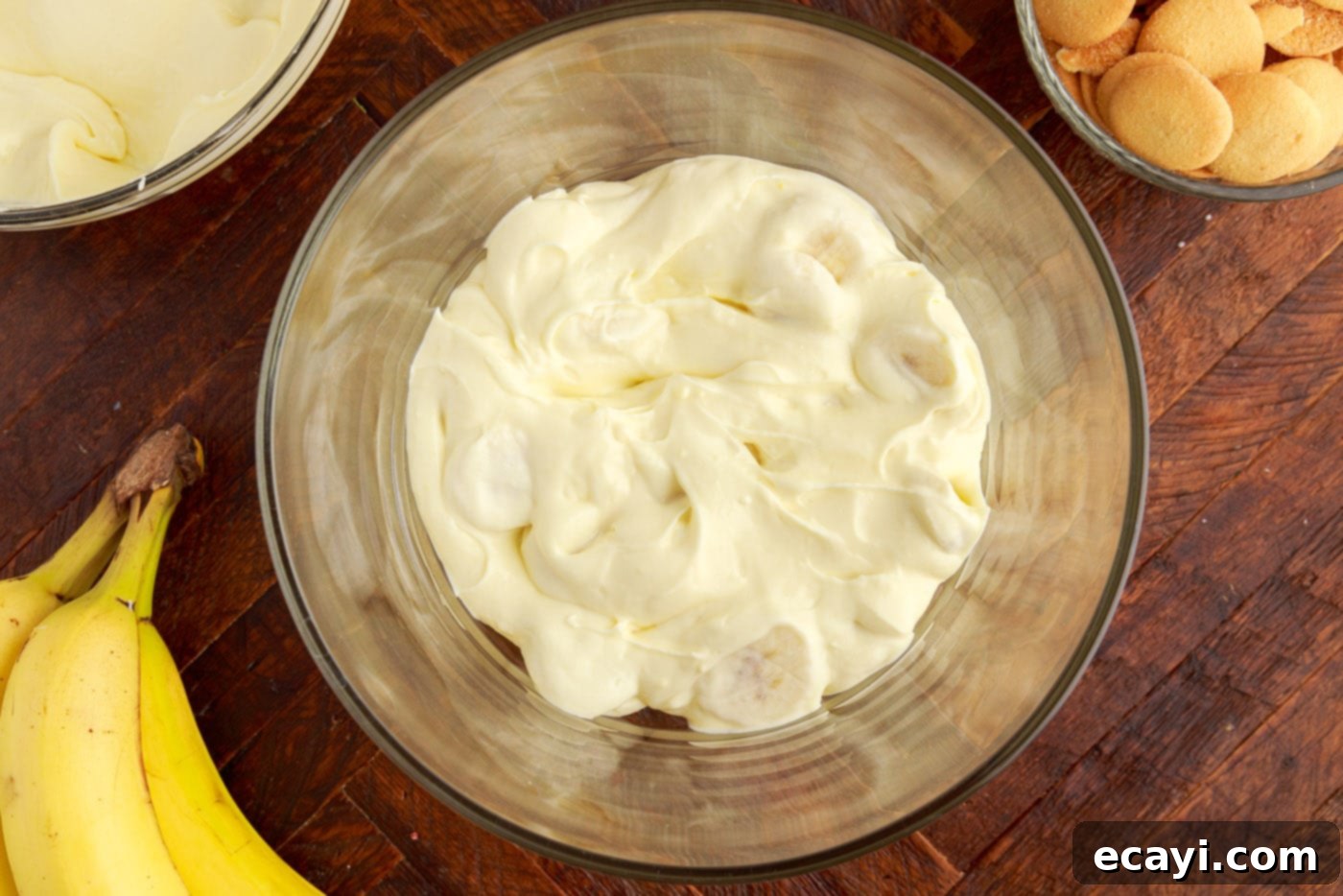 Decadent Banana Layers 11 cream cheese banana pudding mixture in a trifle bowl