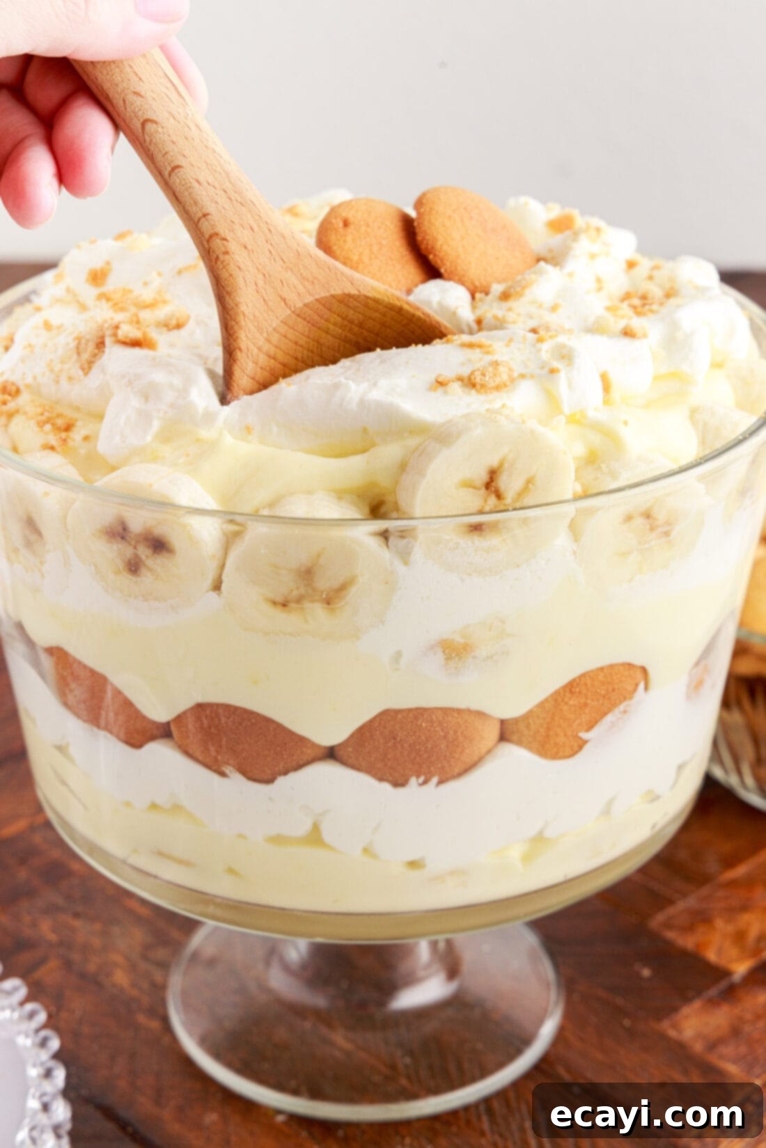 Decadent Banana Layers 3 Serving spoon in a Banana Trifle showing a scoop of the creamy layers