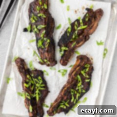 Fall-Off-The-Bone Korean Short Ribs 11 Korean Short Ribs on a sheet pan with parchment paper