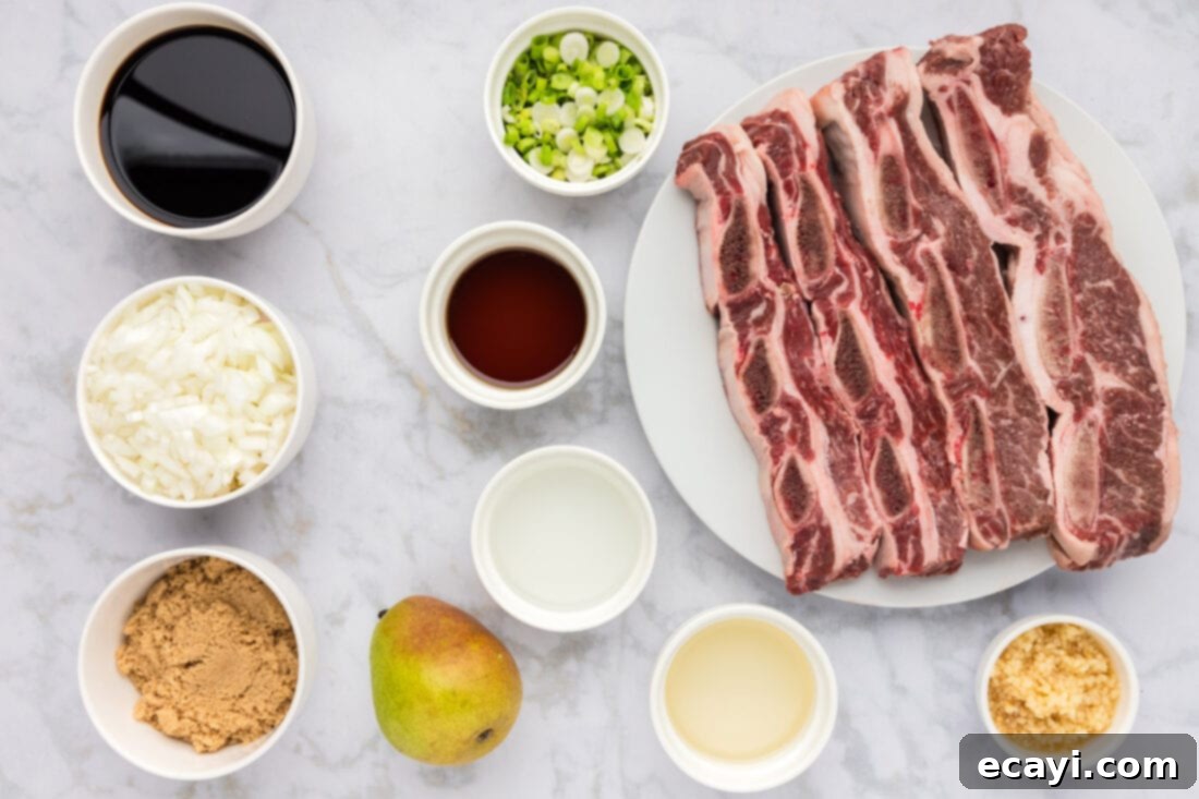 Fall-Off-The-Bone Korean Short Ribs 4 A vibrant display of fresh ingredients for Korean Short Ribs, including soy sauce, garlic, onions, pears, and sesame oil.