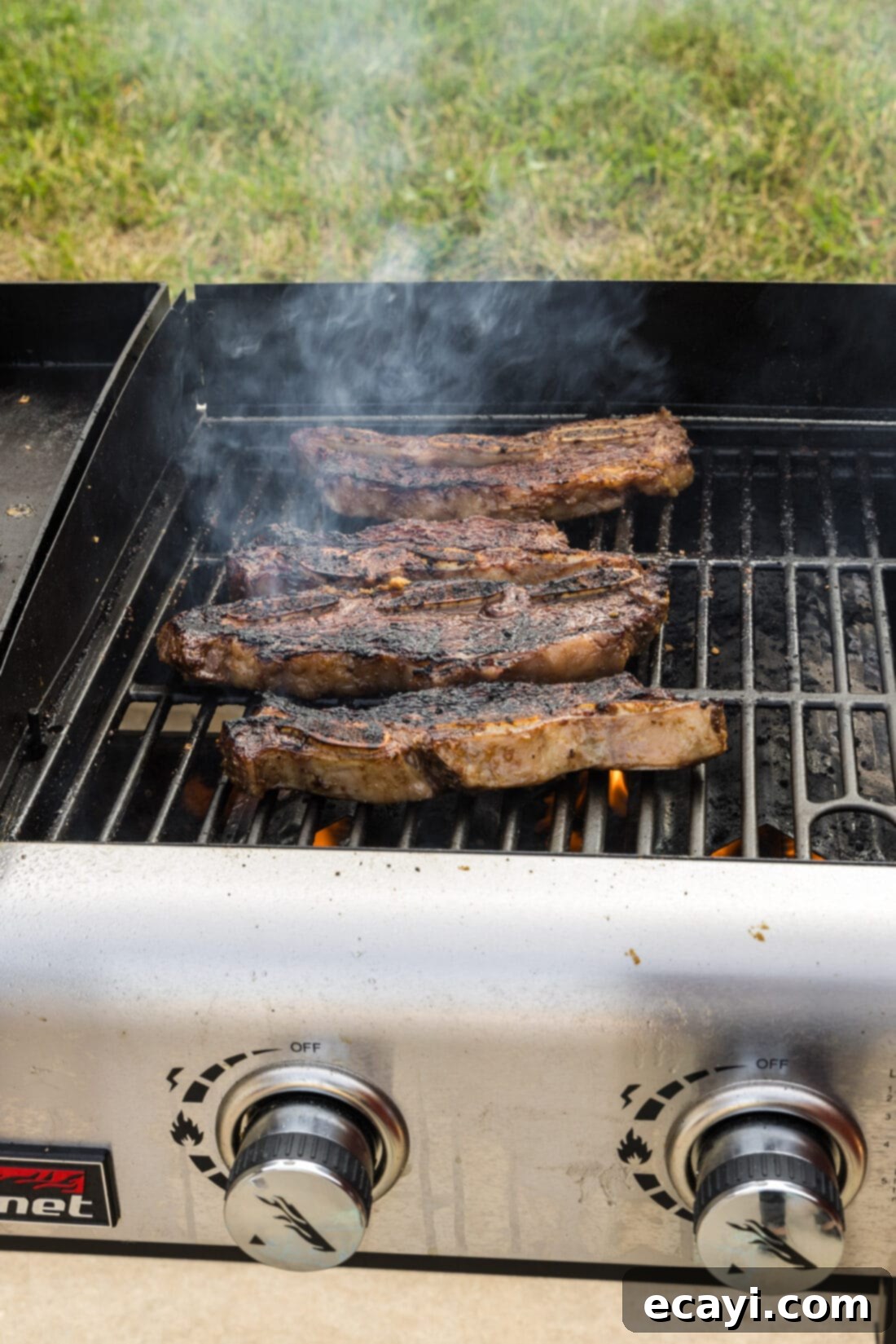 Fall-Off-The-Bone Korean Short Ribs 10 Close-up of freshly grilled Korean Short Ribs on the grill, showing a beautiful char and juicy appearance.