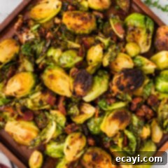 Roasted Brussels Sprouts with Crispy Bacon and Glazed Pecans 20 Close up photo of Brussels Sprouts with Bacon, Shallots and Candied Pecans, ready to be served.