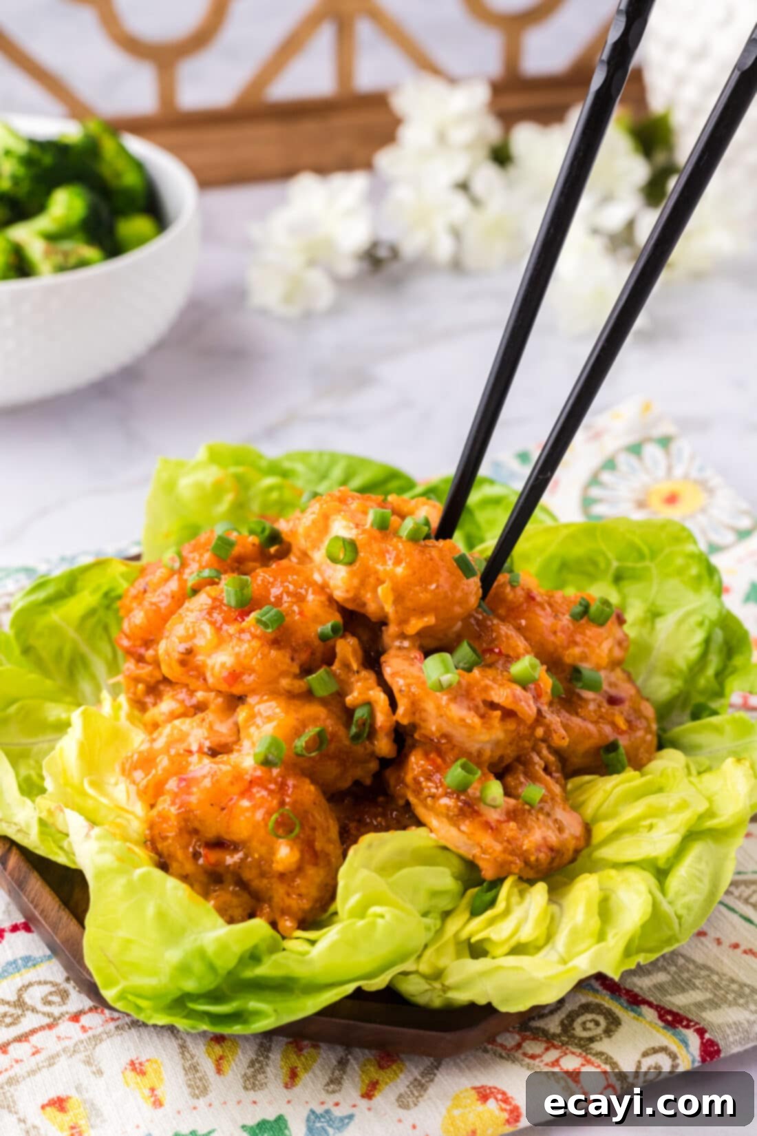 Bang Bang Shrimp 14 Chopsticks grabbing a piece of Bang Bang Shrimp