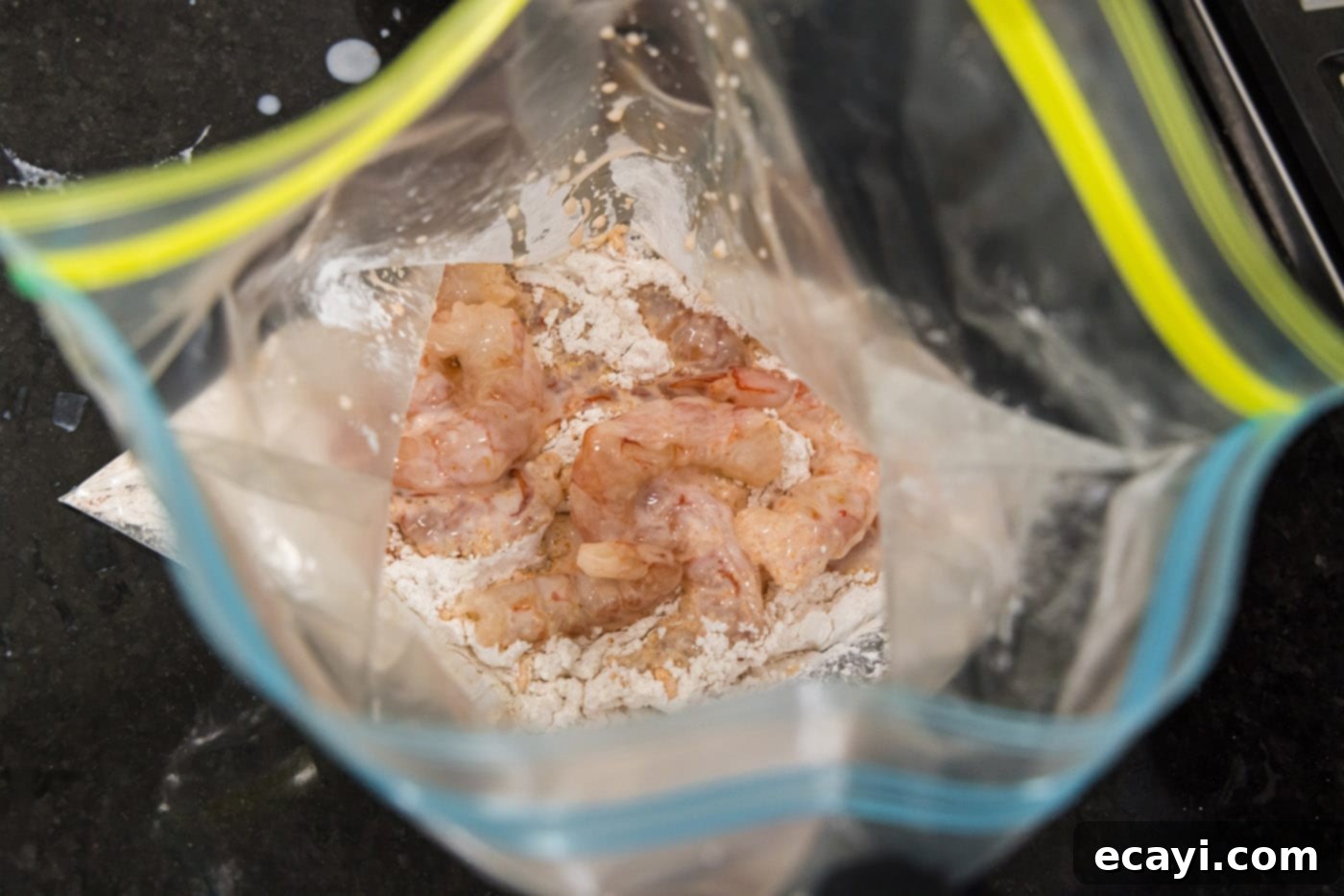 Bang Bang Shrimp 9 marinated shrimp added to flour in a large bag