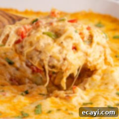 Comforting King Ranch Chicken Casserole 17 Close up photo of a spatula of King Ranch Chicken Casserole, showing its rich, layered texture.