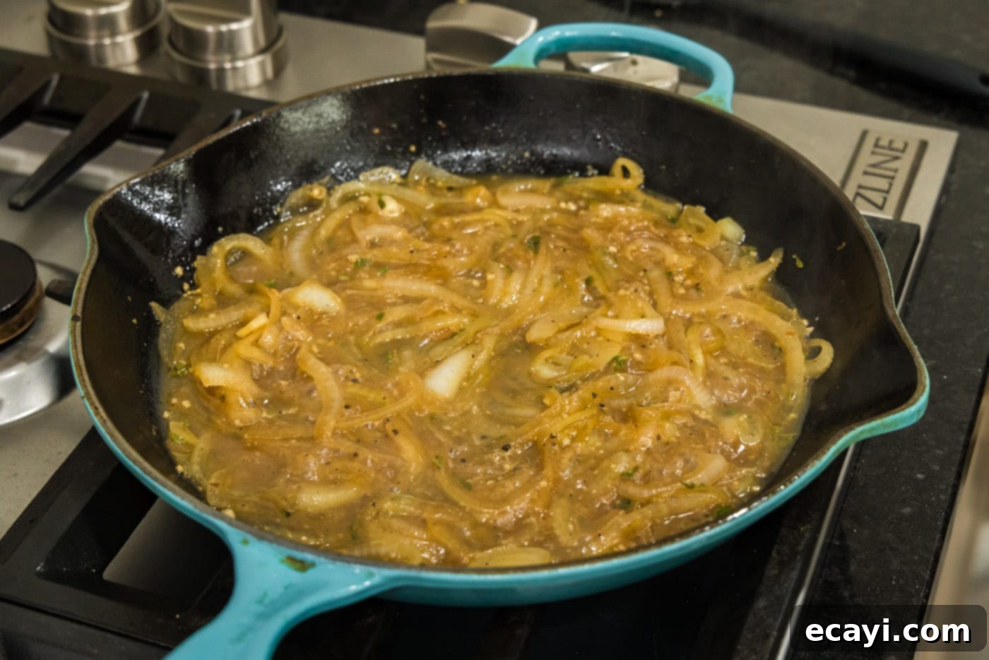 Savory Onion-Thyme Chicken 16 bubbling onion thyme sauce in a skillet