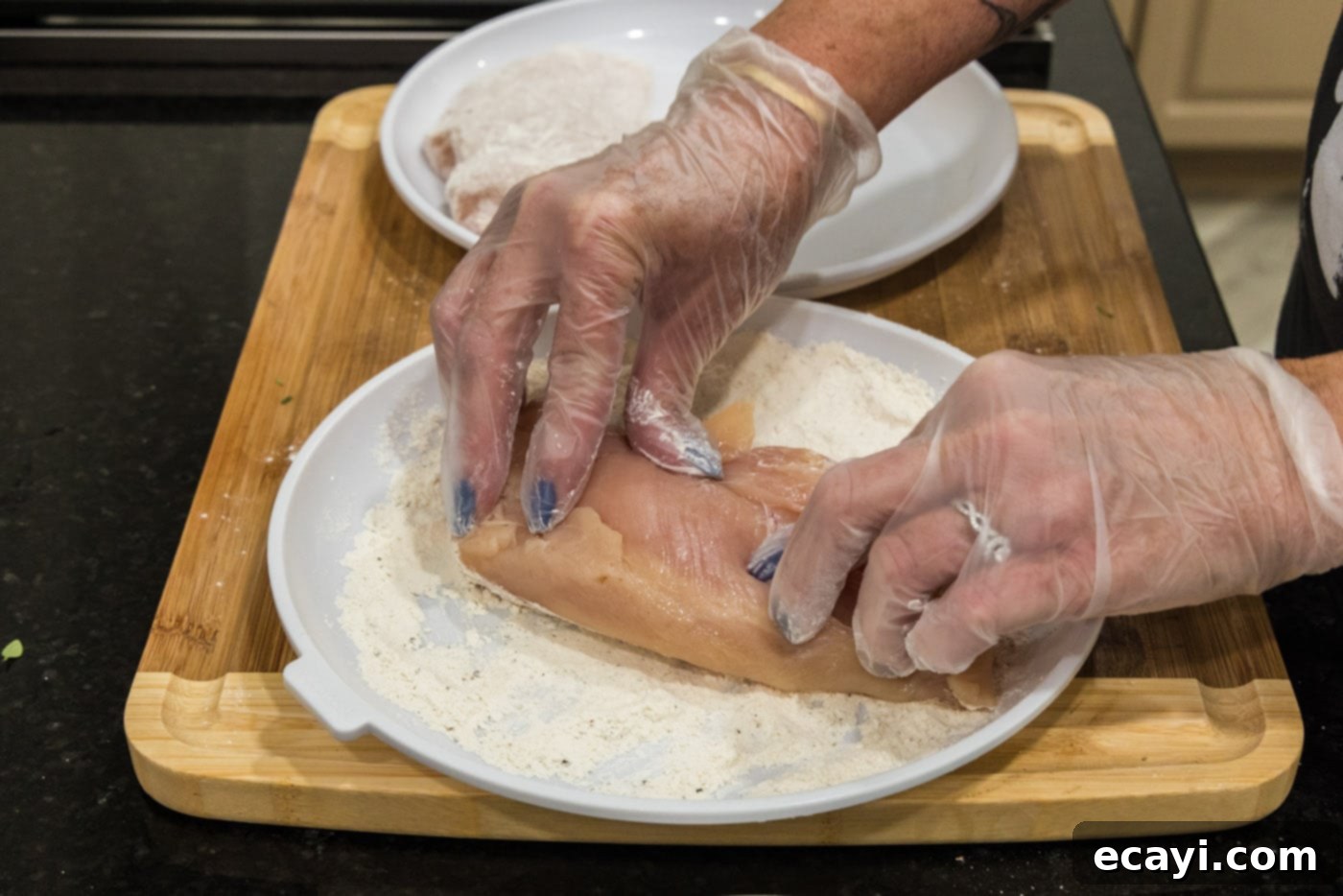 Savory Onion-Thyme Chicken 6 pressing chicken breasts into flour mixture