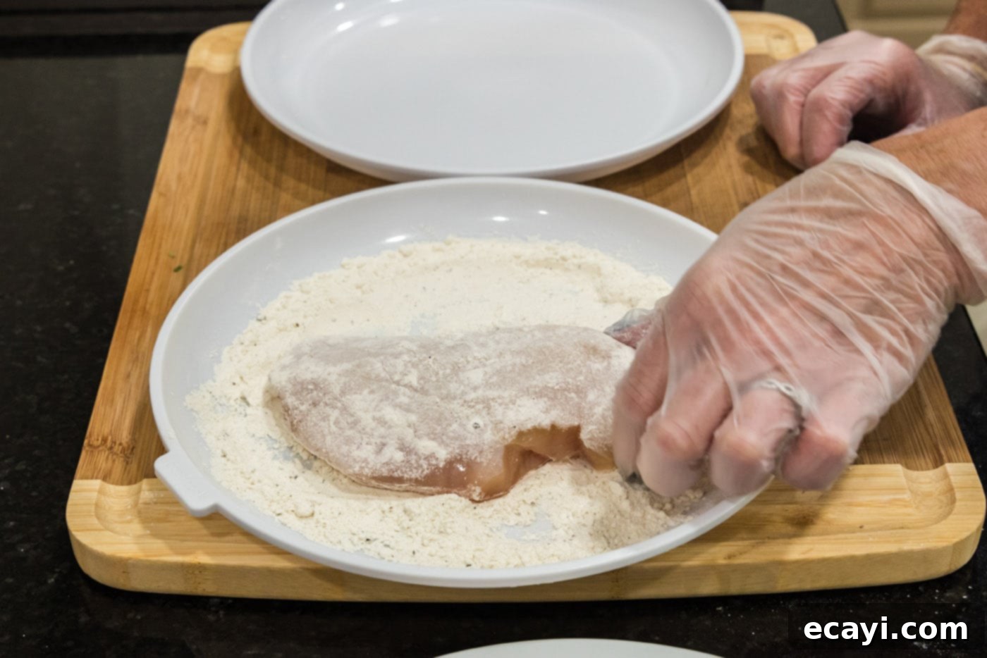 Savory Onion-Thyme Chicken 7 dredging chicken breast in flour