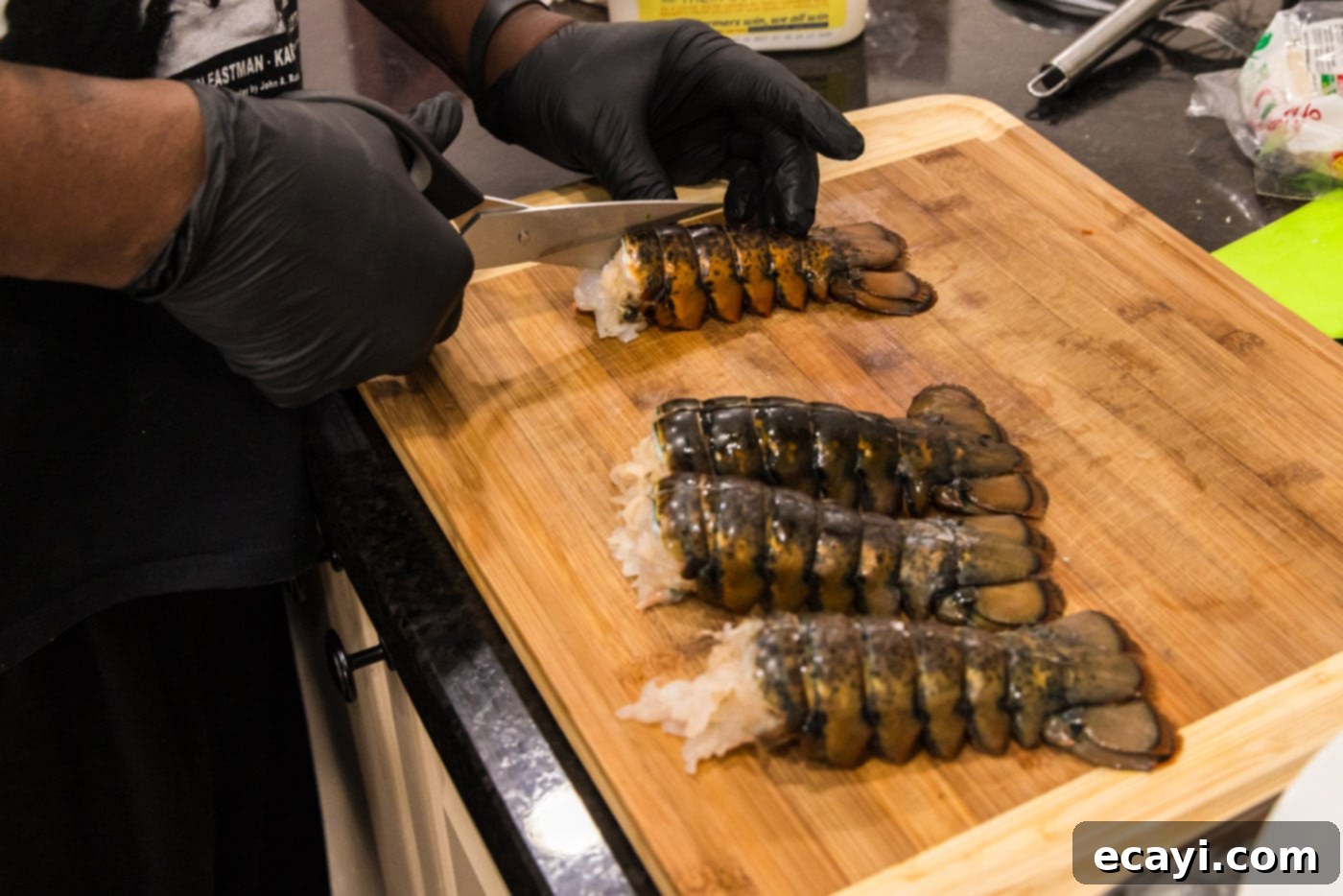 Golden Baked Lobster 5 using kitchen shears to slice through lobster shell