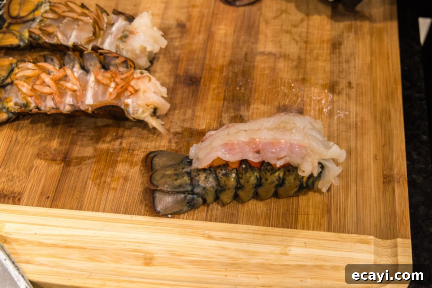 Golden Baked Lobster 9 crowned lobster on a cutting board